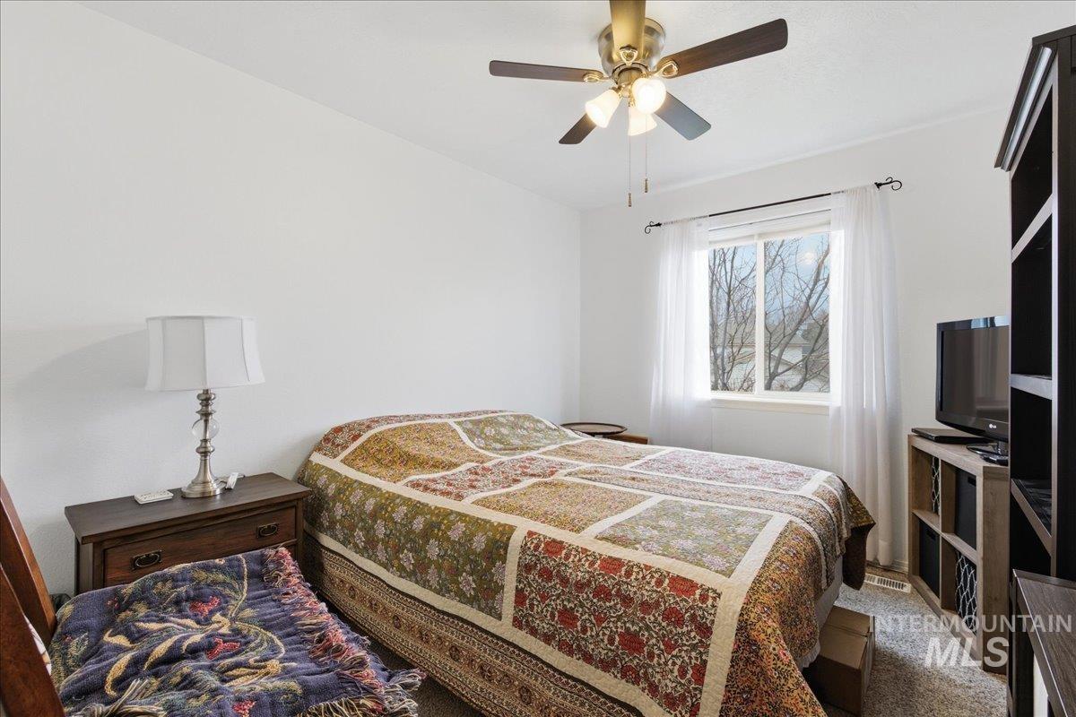 1896 West Ridge Pointe Avenue Nampa, ID 83651 - Photo 29 of 49 Bedroom featuring ceiling fan and light colored carpet