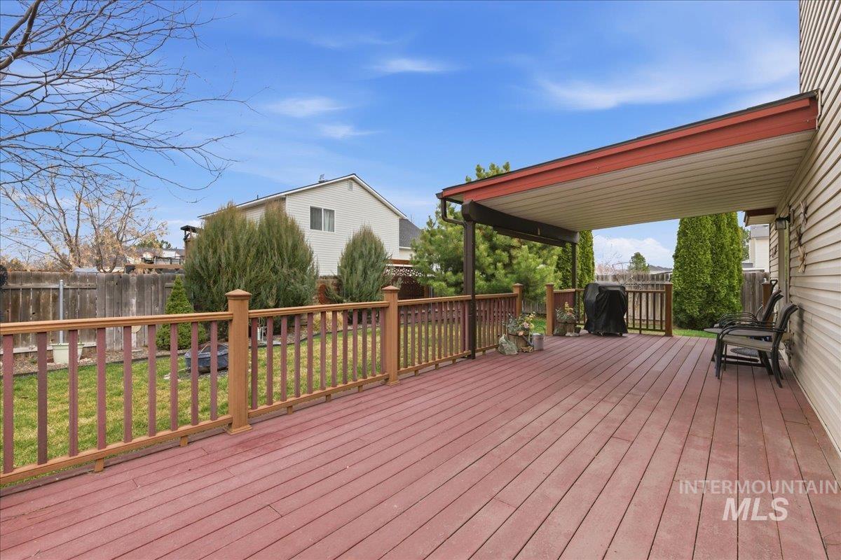 1896 West Ridge Pointe Avenue Nampa, ID 83651 - Photo 32 of 49 Wooden terrace with a fenced backyard and a grill