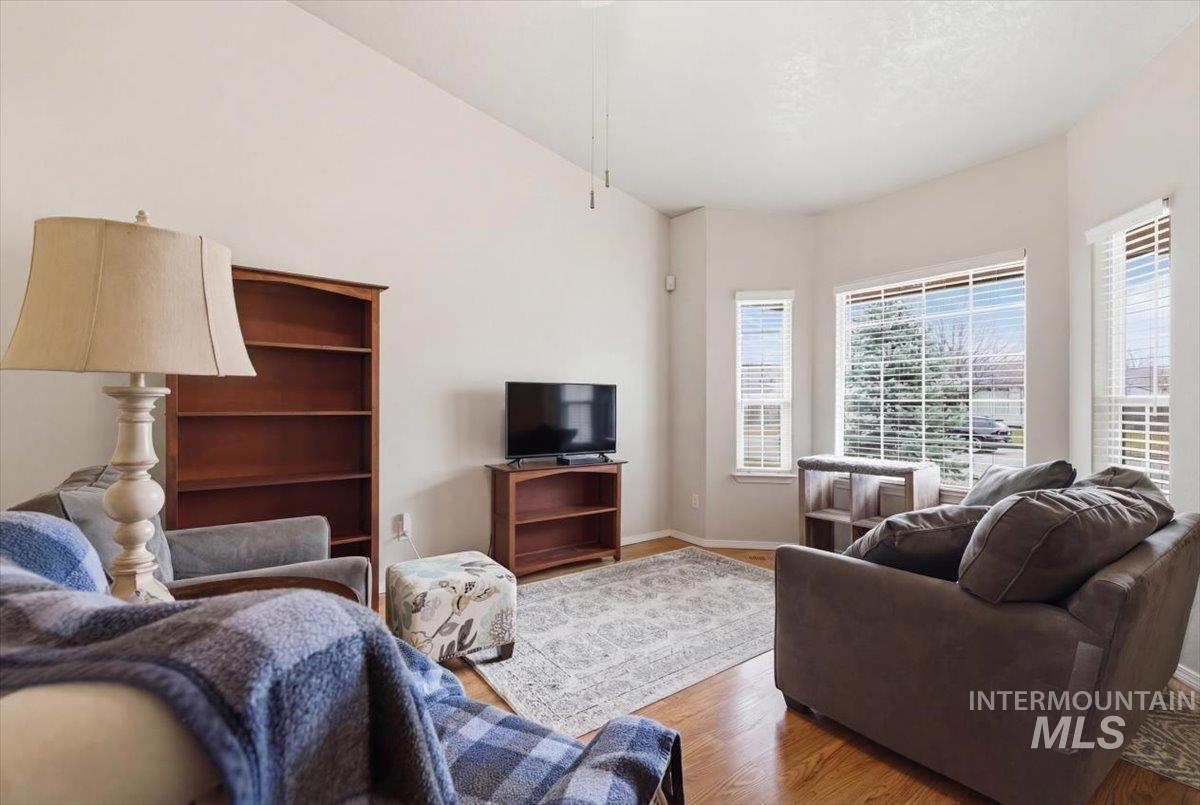 1896 West Ridge Pointe Avenue Nampa, ID 83651 - Photo 8 of 49 Living area featuring wood finished floors and baseboards