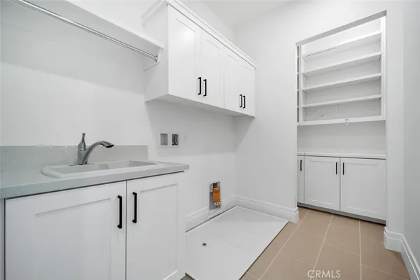 a kitchen with a sink and cabinets