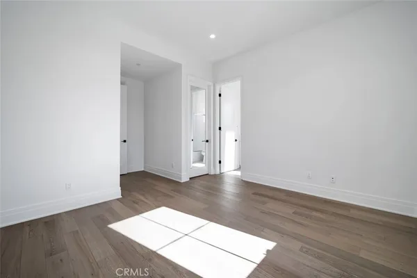 an empty room with wooden floor