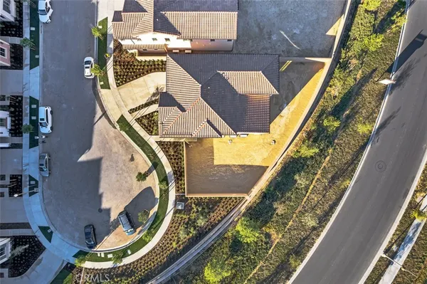 an aerial view of a house with a swimming pool