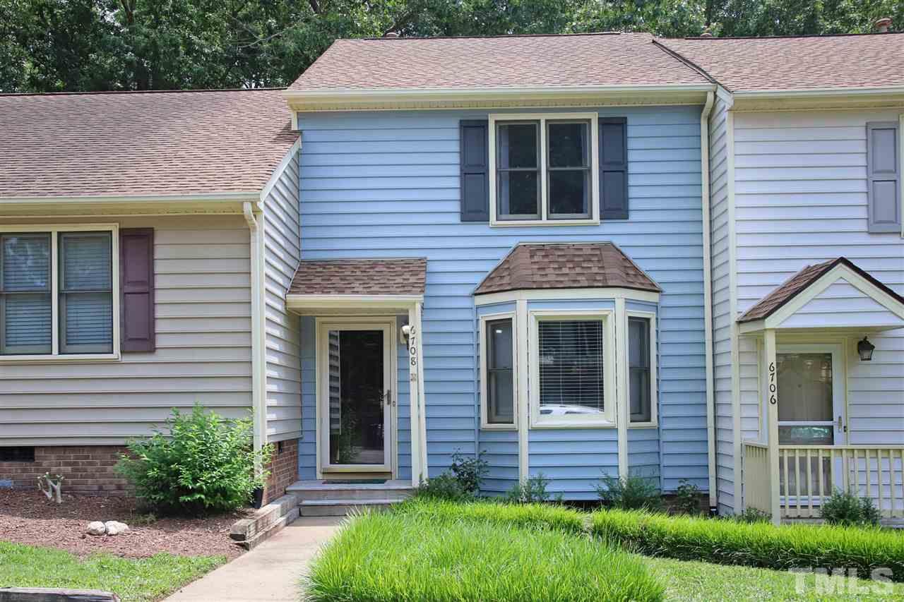 6708 Chauncey Drive Raleigh, NC 27615 - Photo 1 of 25 a front view of a house with a yard