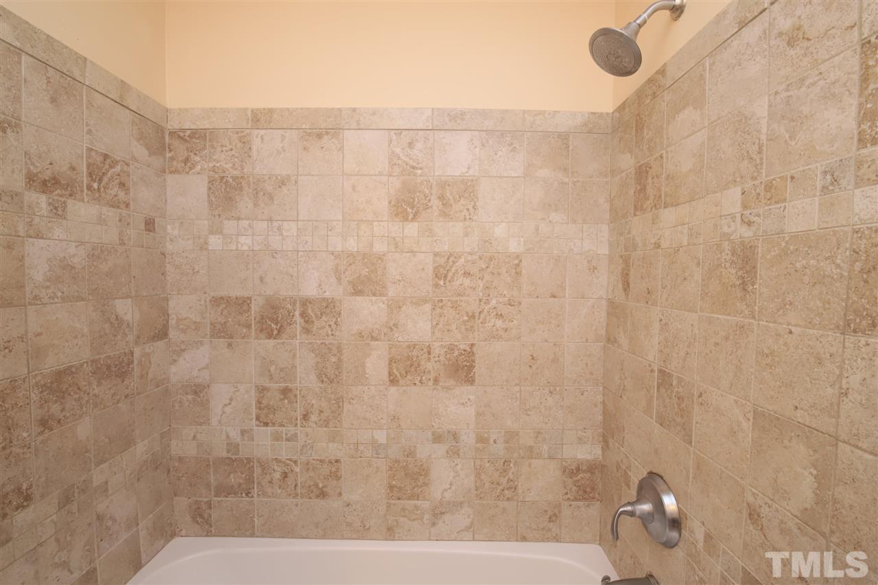 6708 Chauncey Drive Raleigh, NC 27615 - Photo 15 of 25 a bathroom with a shower