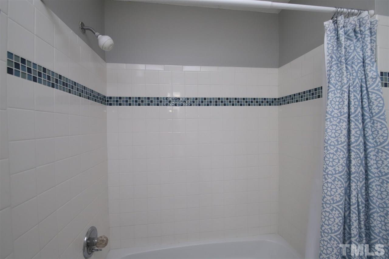 6708 Chauncey Drive Raleigh, NC 27615 - Photo 19 of 25 a close up of a bathtub
