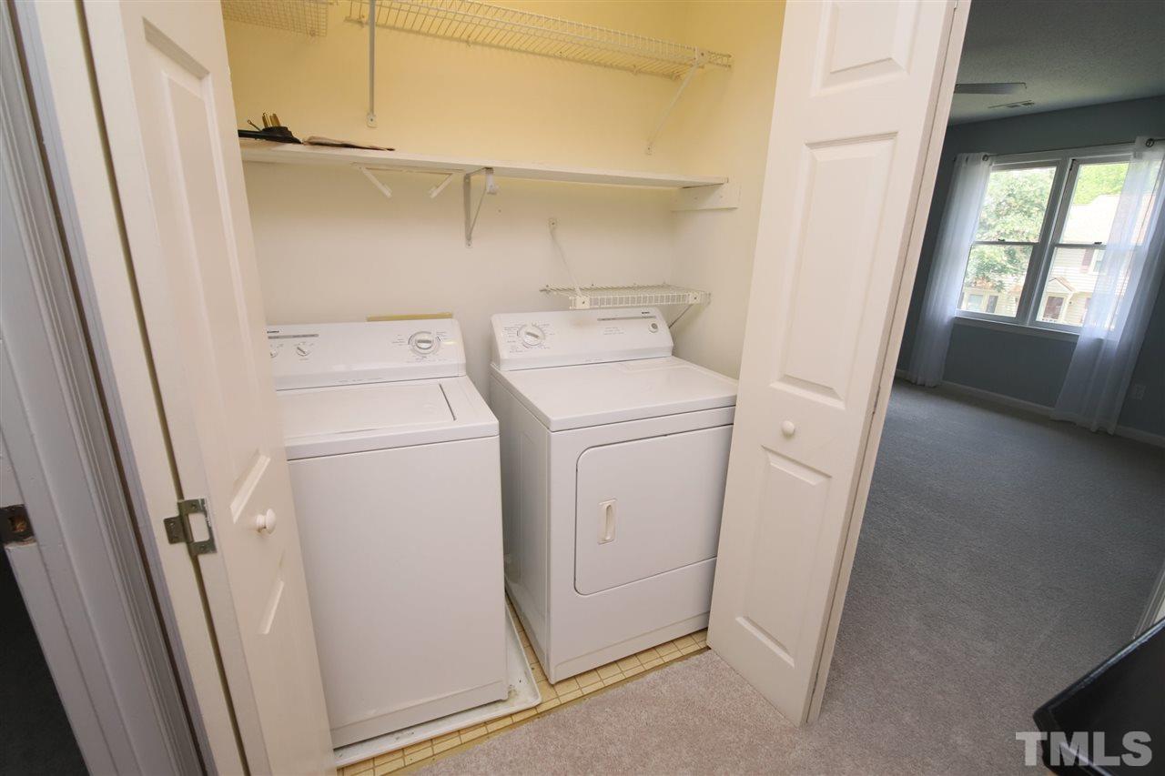 6708 Chauncey Drive Raleigh, NC 27615 - Photo 20 of 25 a view of storage and utility room with washer and dryer