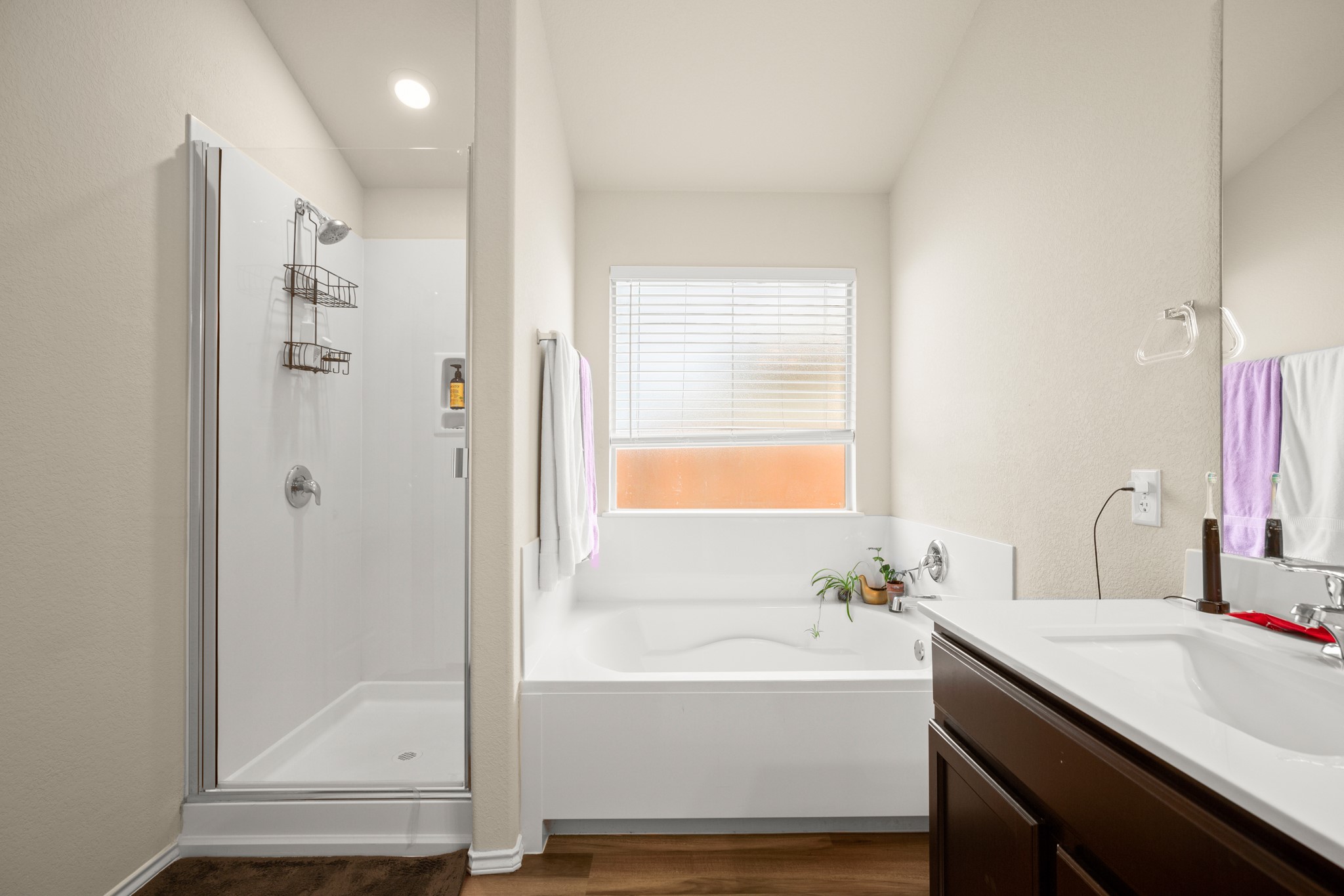 5526 Perdita Drive Belton, TX 76513 - Photo 11 of 26 Bathroom featuring vanity, a bath, a stall shower, and dark wood-style floors