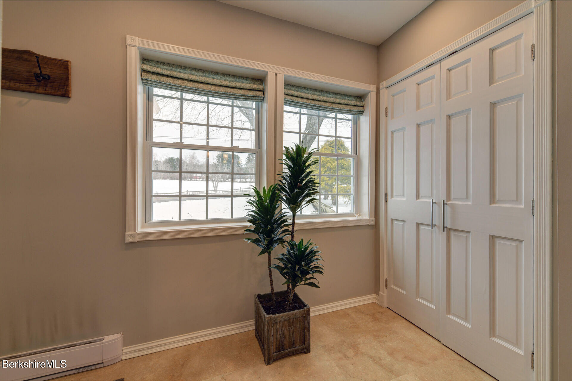 43 Chapman Road Pittsfield, MA 01201 - Photo 15 of 26 a potted plant sitting in front of a window