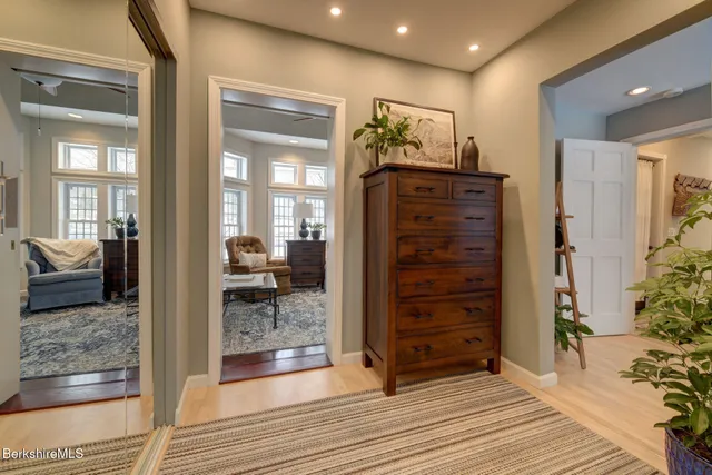 a view of walk in closet and bedroom