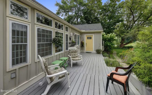 a view of a chair and table in the balcony