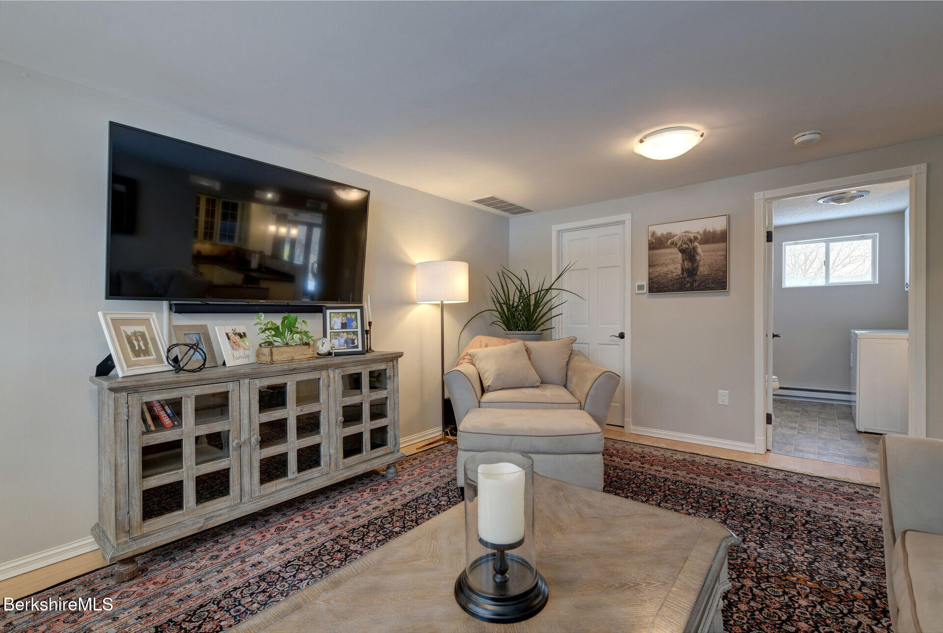 43 Chapman Road Pittsfield, MA 01201 - Photo 5 of 26 a living room with furniture and a flat screen tv