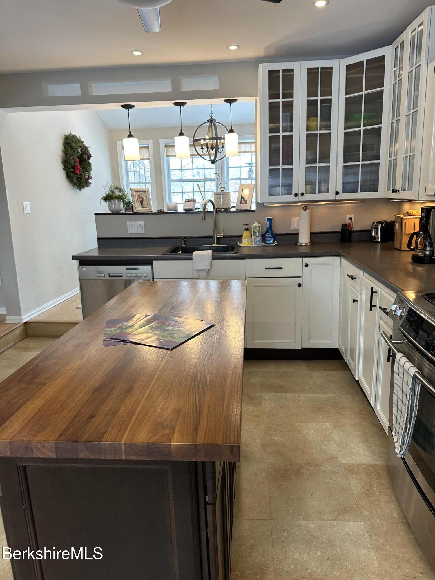 43 Chapman Road Pittsfield, MA 01201 - Photo 8 of 26 a kitchen with stainless steel appliances granite countertop a sink and a stove