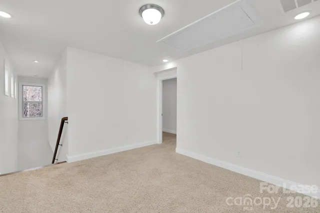 an empty room with a bathroom