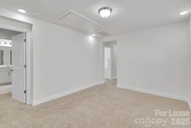 a bathroom with a sink a mirror and a vanity