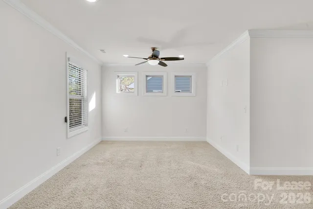 a spacious bathroom with 2 sink shower and a mirror