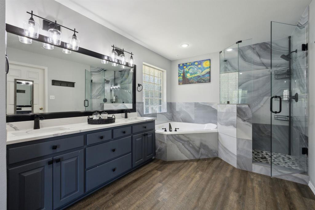2859 Rodeo Drive Quinlan, TX 75474 - Photo 16 of 35 Dual sinks, separate shower and water closet, HUGE walk in closet...this bath is ooolala!
