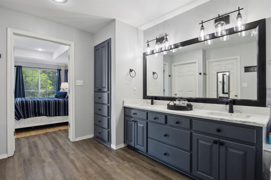 2859 Rodeo Drive Quinlan, TX 75474 - Photo 17 of 35 Dual sinks, separate shower and water closet, HUGE walk in closet...this bath is ooolala!