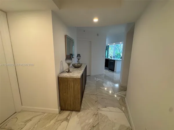 a room with wooden floor and furniture