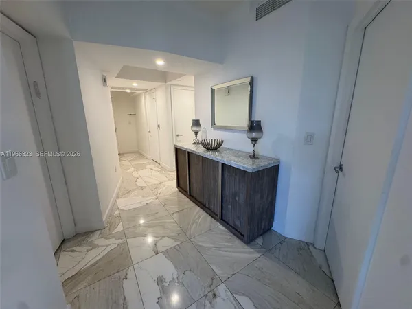 a view of a bathroom from the hallway