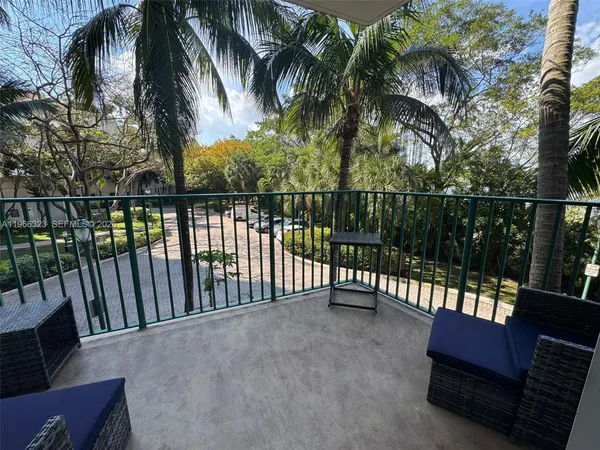 a view of balcony with furniture