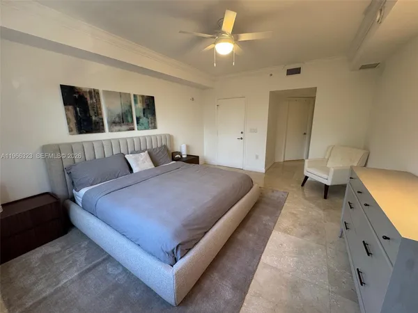 a bed room with a bed and a window