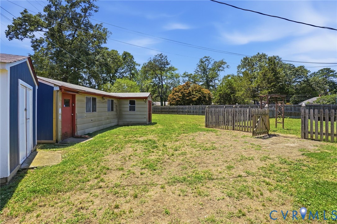 2403 Omega Road Henrico, VA 23228 - Photo 34 of 39 a view of a backyard with a tree