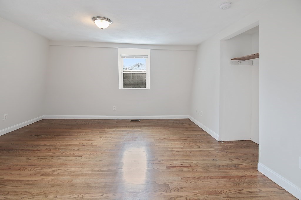 23 Marcella Street, Unit 2 Boston, MA 02119 - Photo 16 of 26 wooden floor in an empty room