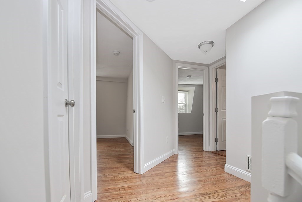 23 Marcella Street, Unit 2 Boston, MA 02119 - Photo 24 of 26 a view of hallway with wooden floor