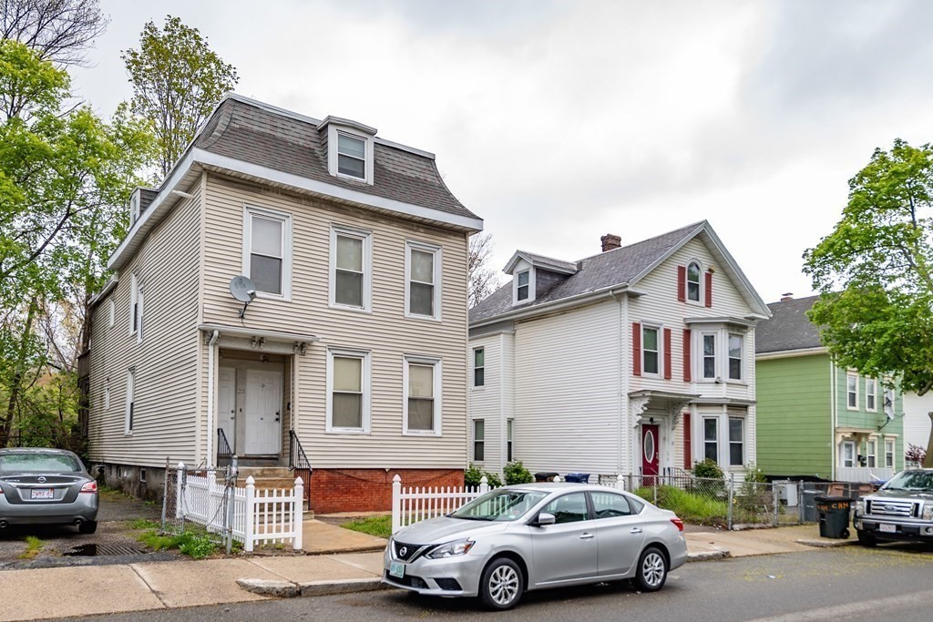 23 Marcella Street, Unit 2 Boston, MA 02119 - Photo 26 of 26 a car parked in front of a house