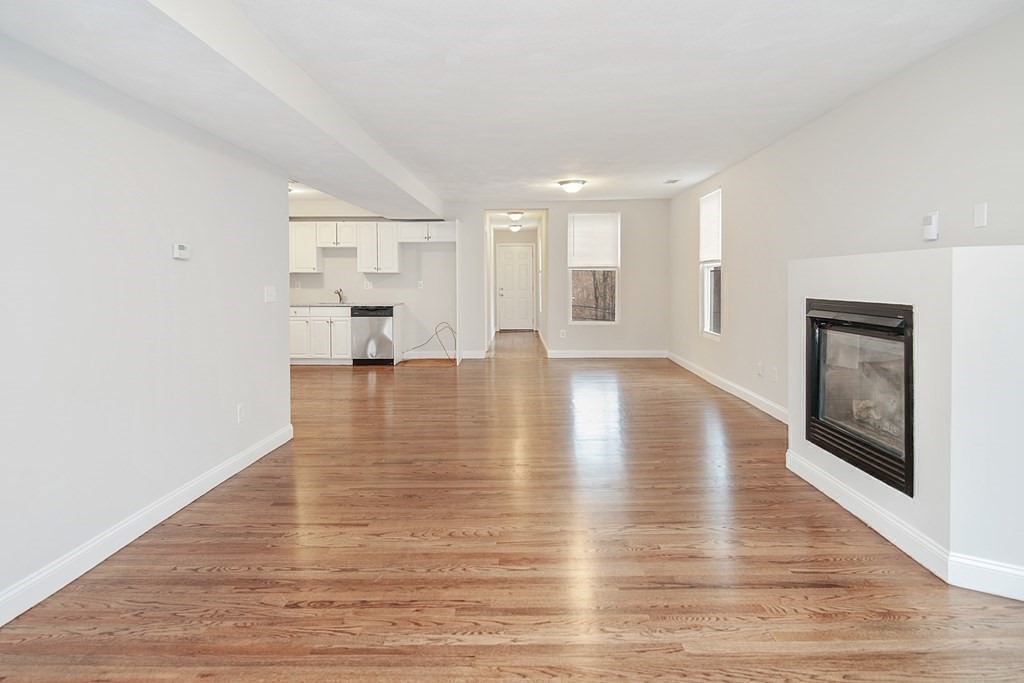 23 Marcella Street, Unit 2 Boston, MA 02119 - Photo 7 of 26 a view of an empty room with window and wooden floor