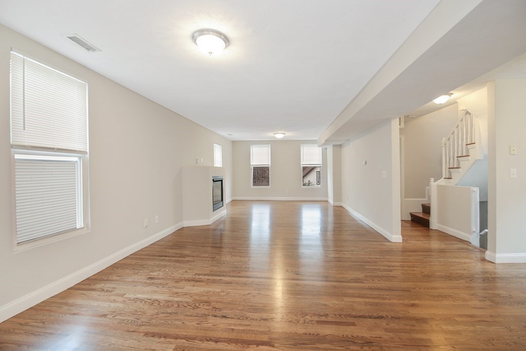 23 Marcella Street, Unit 2 Boston, MA 02119 - Photo 8 of 26 a view of empty room with wooden floor