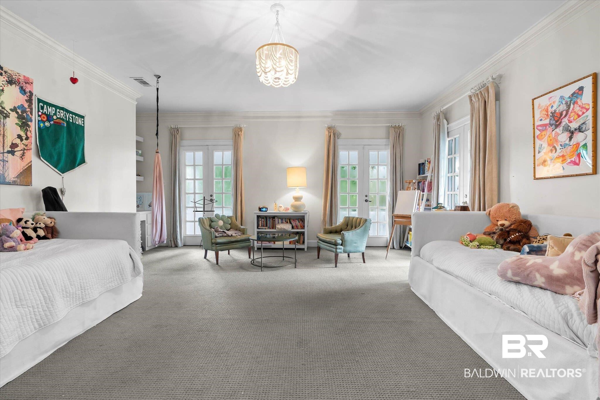 3908 Yester Place Mobile, AL 36608 - Photo 28 of 45 Spacious room featuring light gray carpeting, a decorative central chandelier, and white crown molding