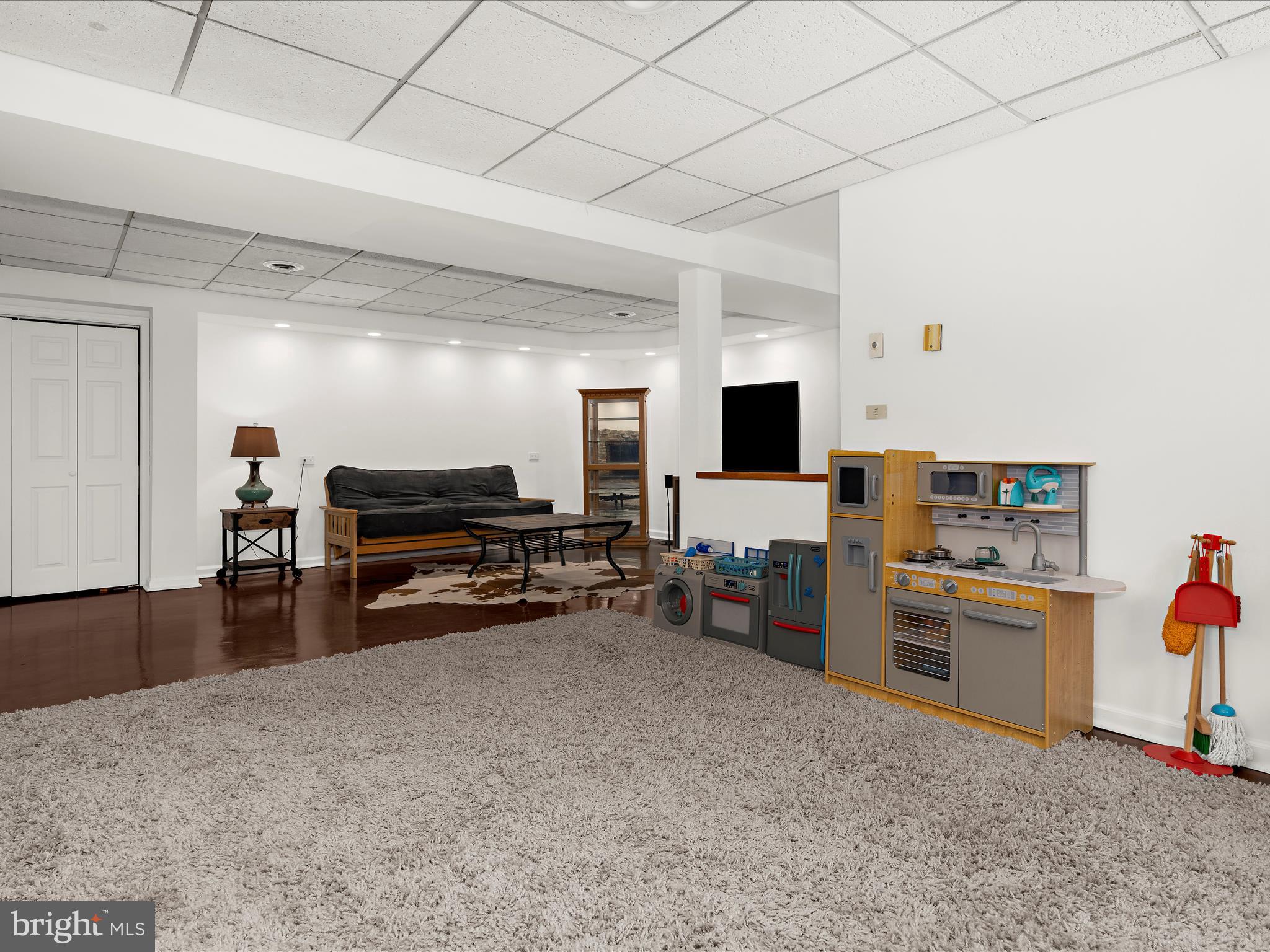 5306 Stone Road Frederick, MD 21703 - Photo 20 of 61 a room with furniture and a flat screen tv