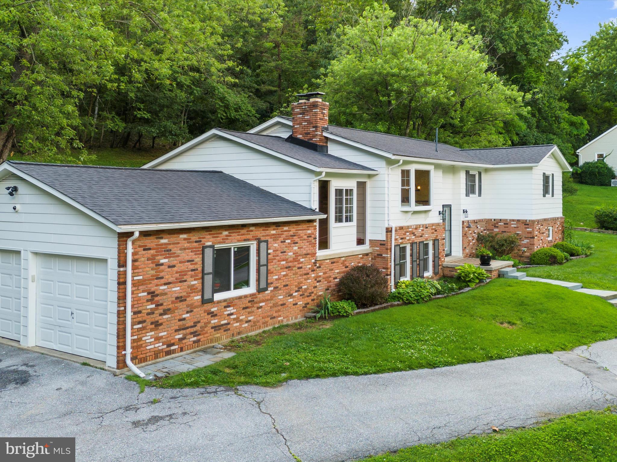 5306 Stone Road Frederick, MD 21703 - Photo 3 of 61 a front view of a house with a yard