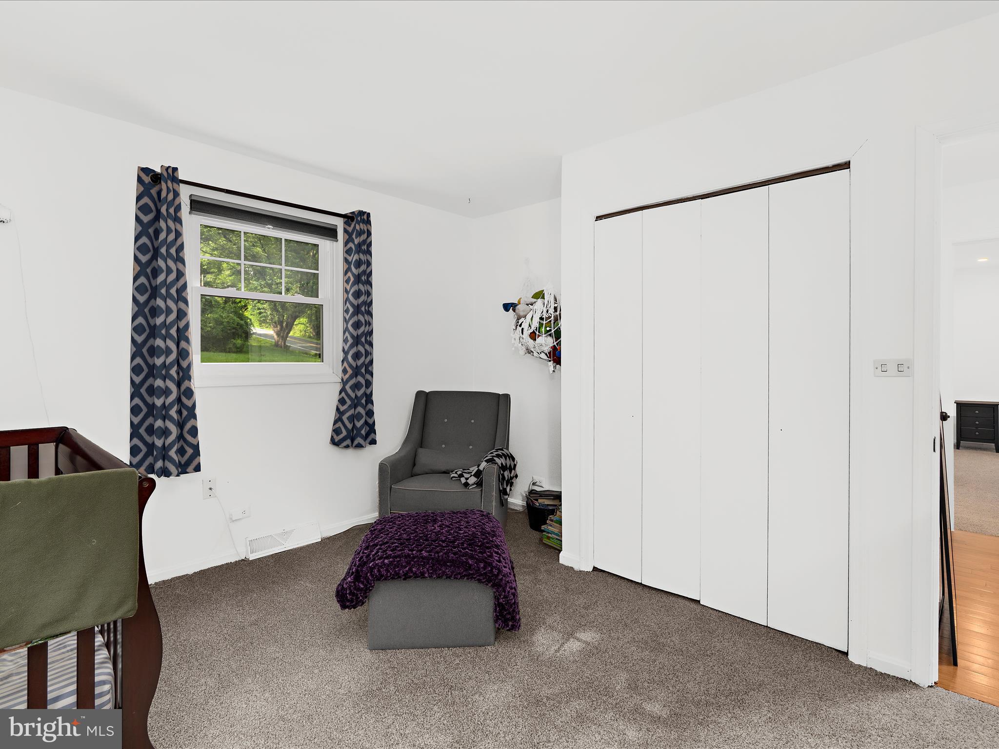 5306 Stone Road Frederick, MD 21703 - Photo 32 of 61 a room with furniture and a window