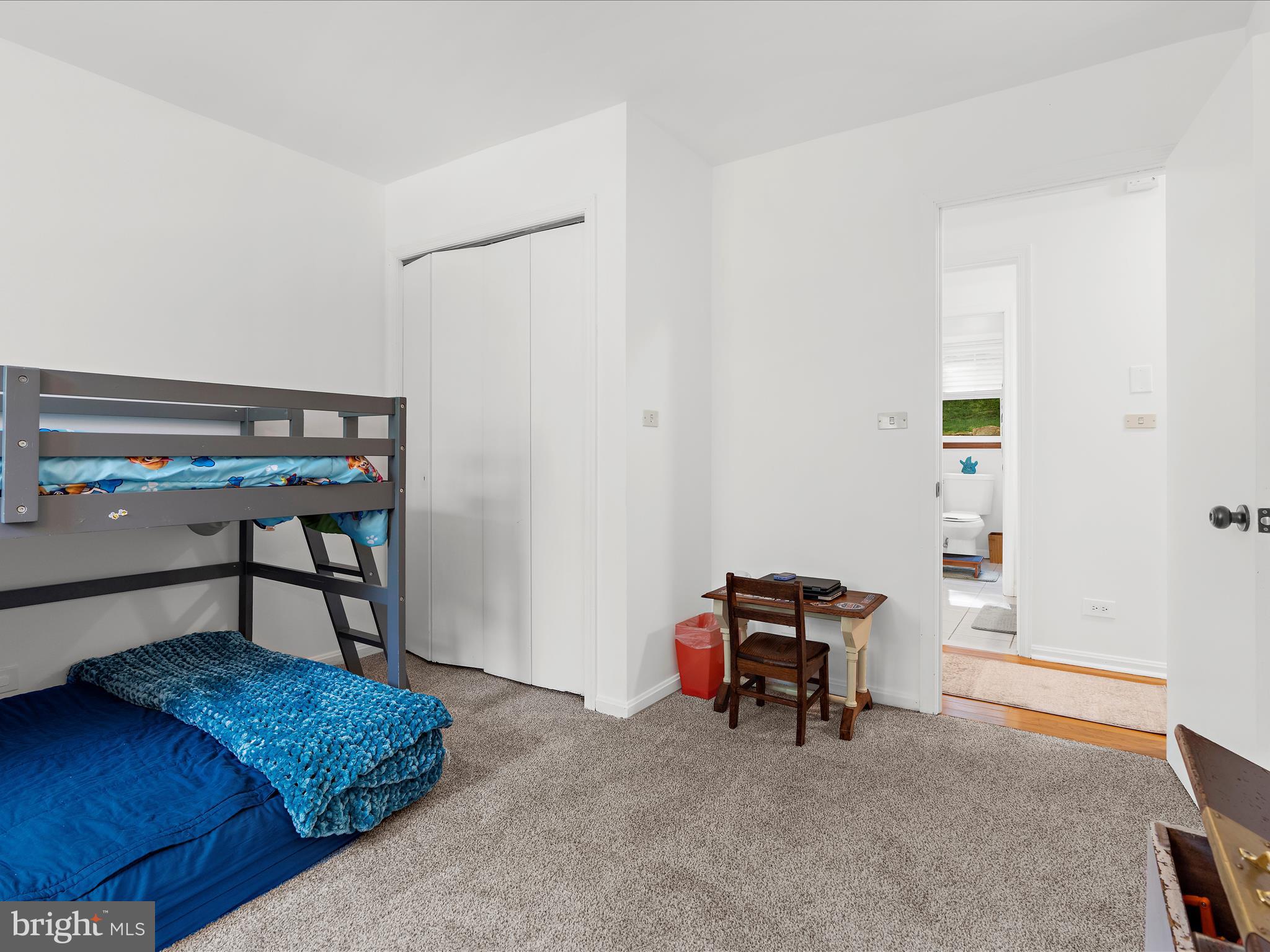 5306 Stone Road Frederick, MD 21703 - Photo 34 of 61 a bedroom with a bed and a chandelier