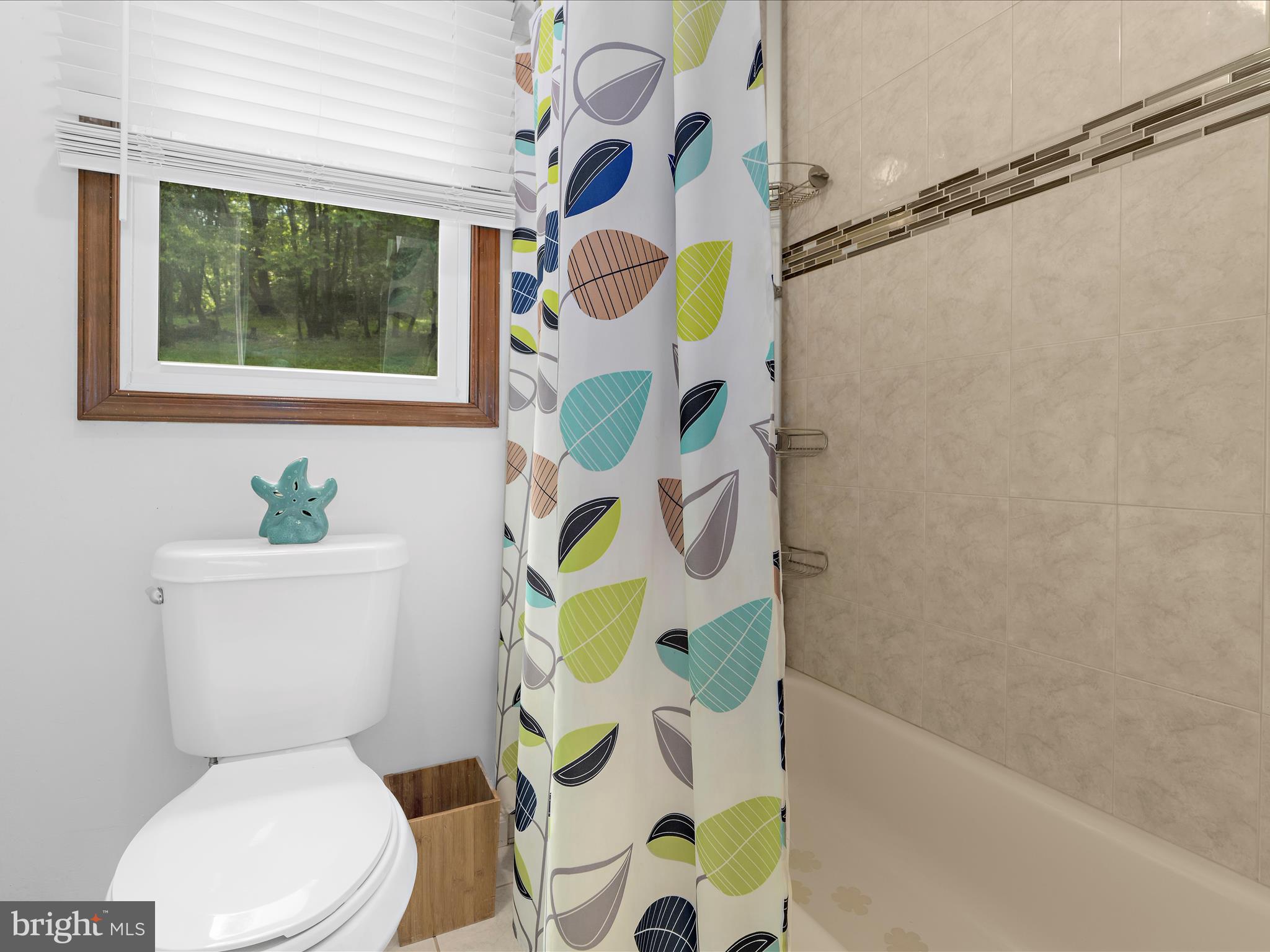 5306 Stone Road Frederick, MD 21703 - Photo 36 of 61 a white toilet sitting next to a bath tub