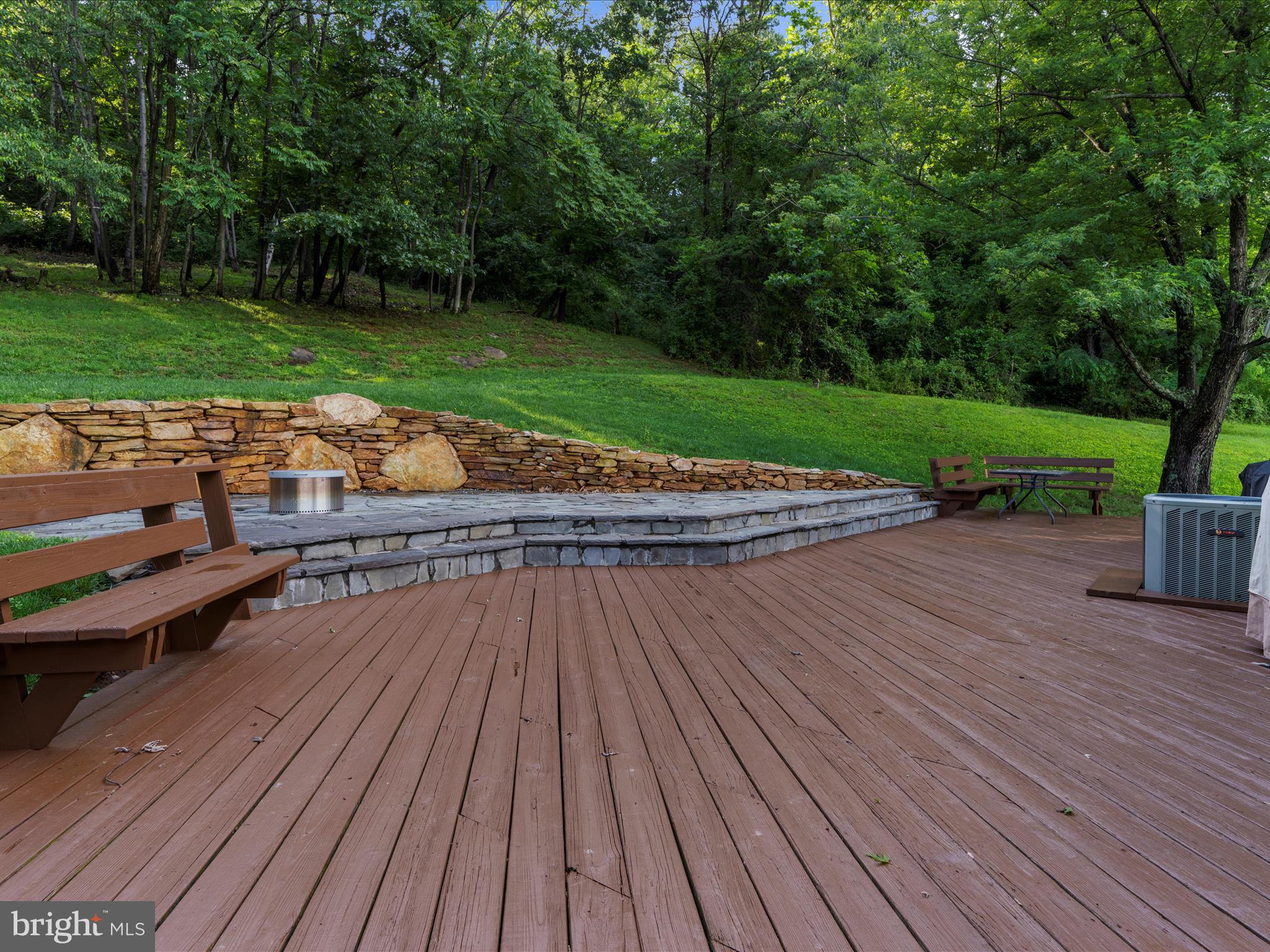 5306 Stone Road Frederick, MD 21703 - Photo 37 of 61 a view of a wooden deck with a yard