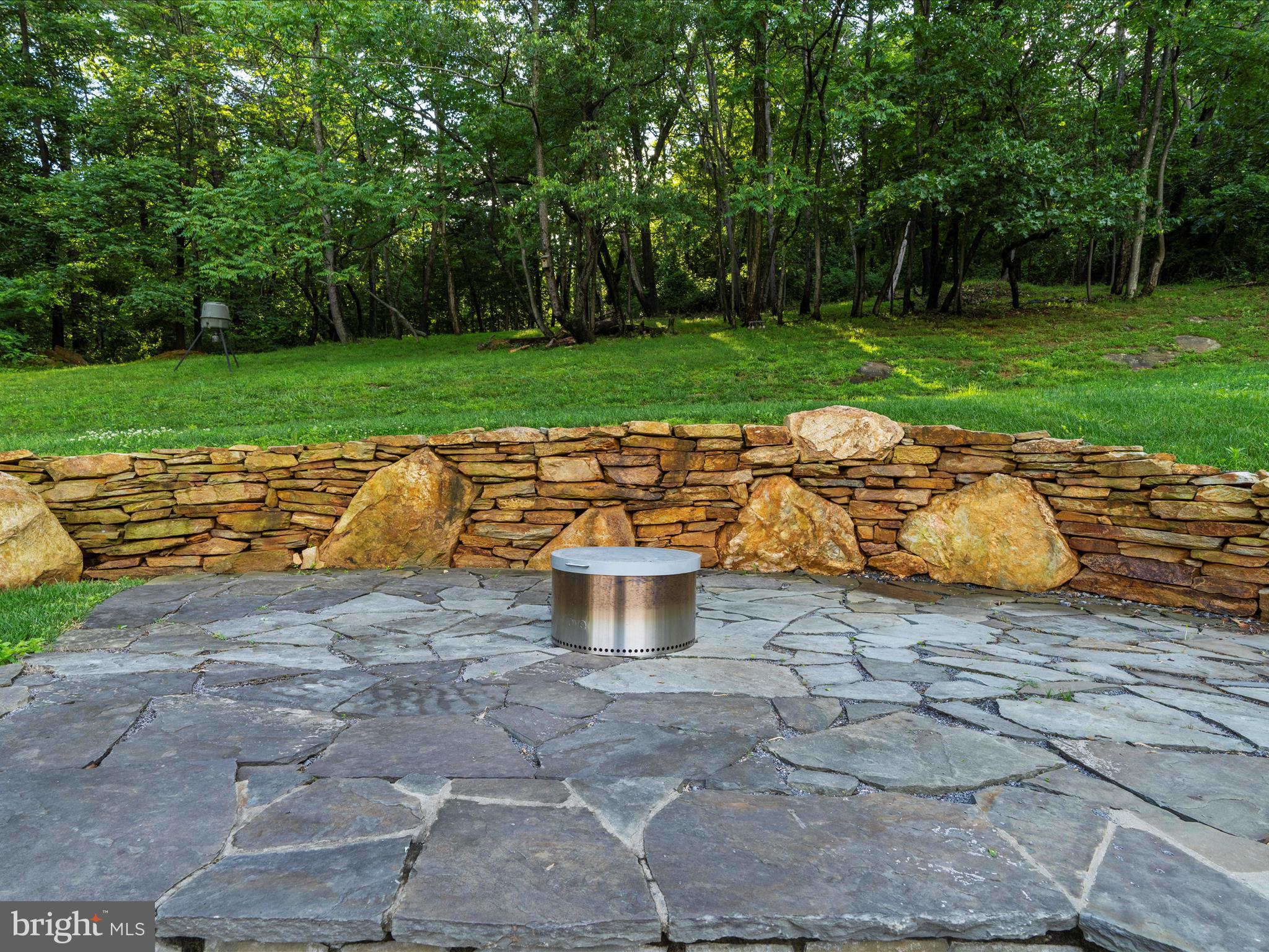 5306 Stone Road Frederick, MD 21703 - Photo 40 of 61 a view of a backyard with plants and garden