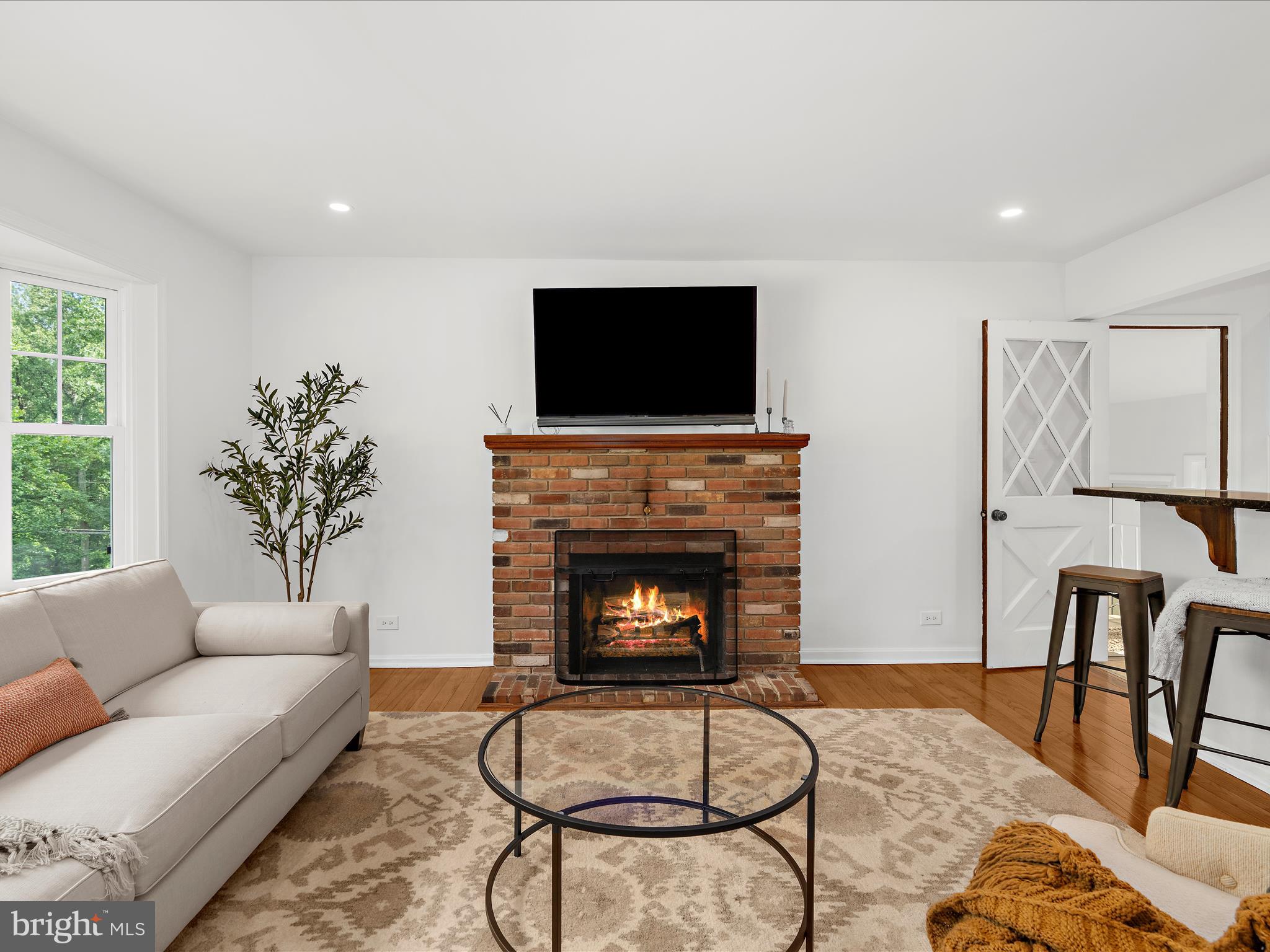 5306 Stone Road Frederick, MD 21703 - Photo 5 of 61 a living room with furniture and a fireplace