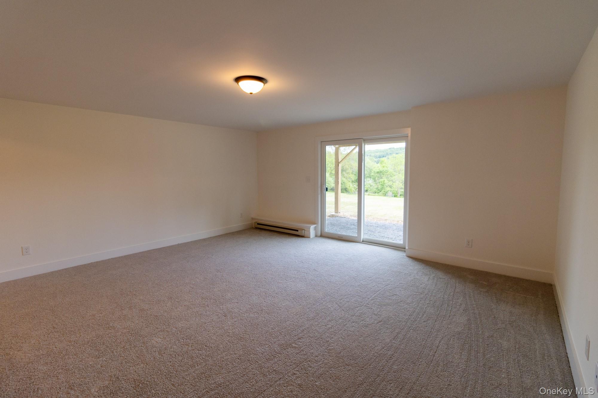 750 Ridgebury Road Slate Hill, NY 10973 - Photo 20 of 41 an empty room with windows