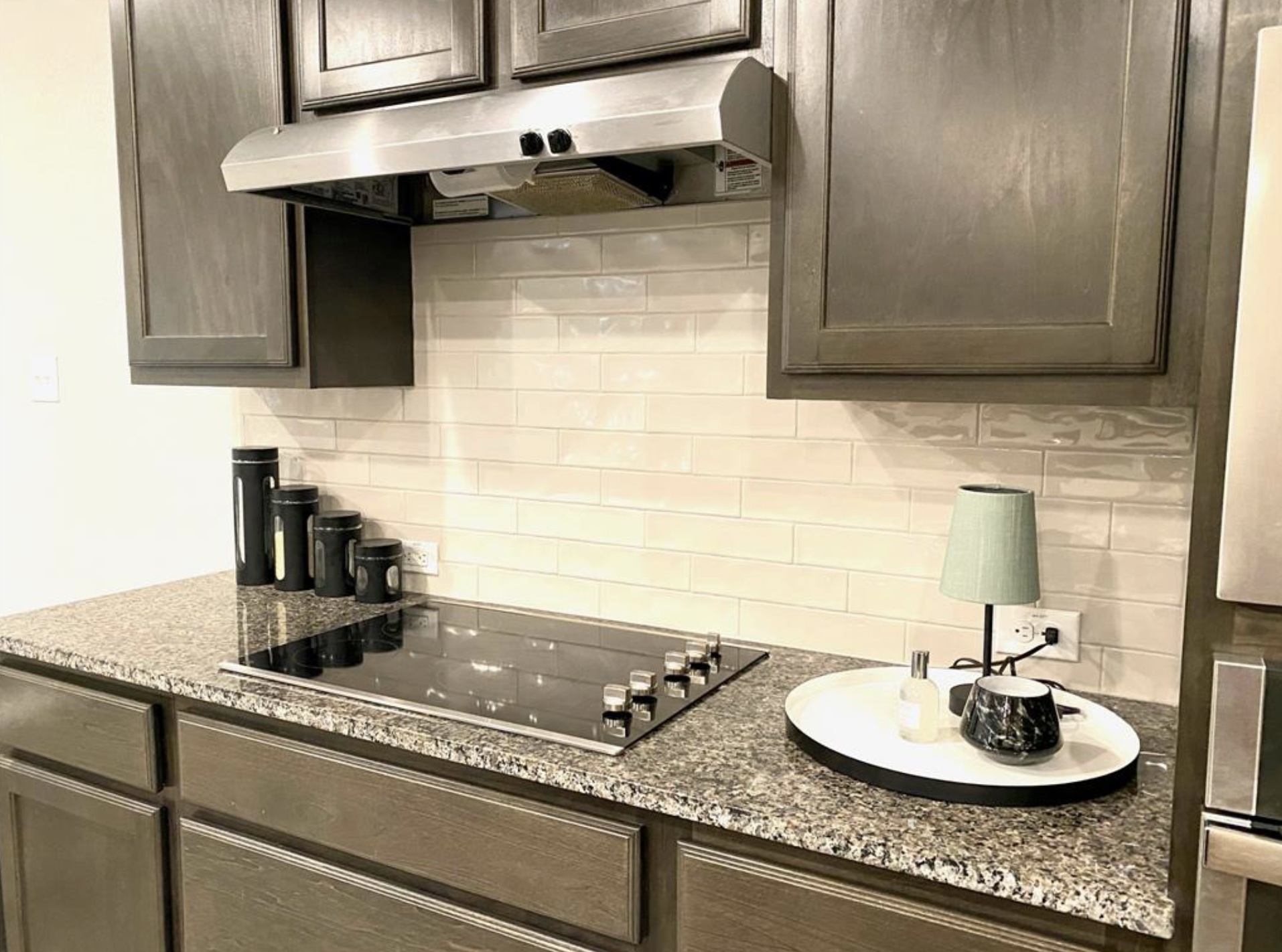 21643 Boggy Ford Road Lago Vista, TX 78645 - Photo 2 of 14 a kitchen with a sink and a stove with wooden floor