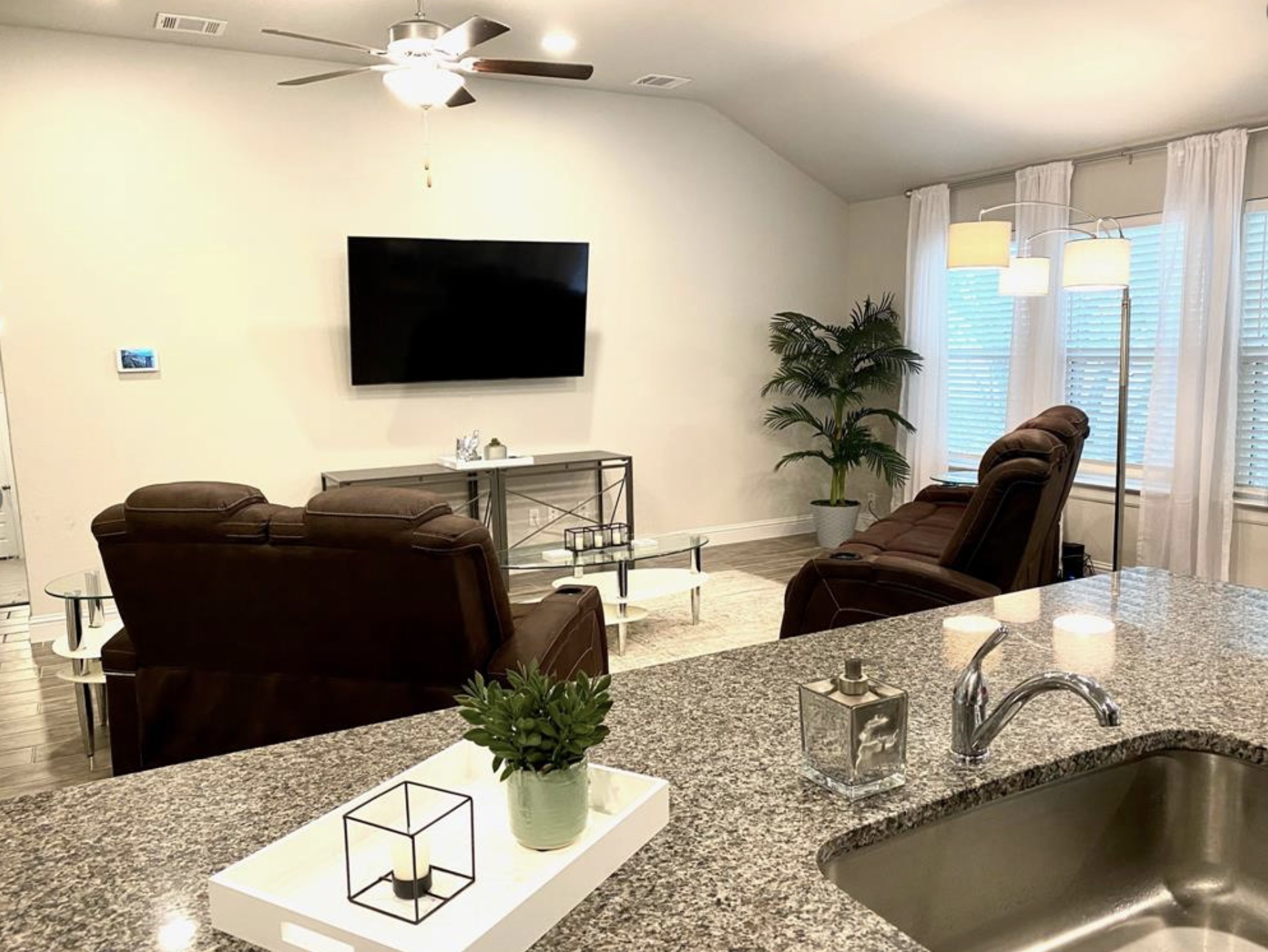 21643 Boggy Ford Road Lago Vista, TX 78645 - Photo 5 of 14 a living room with furniture and a flat screen tv