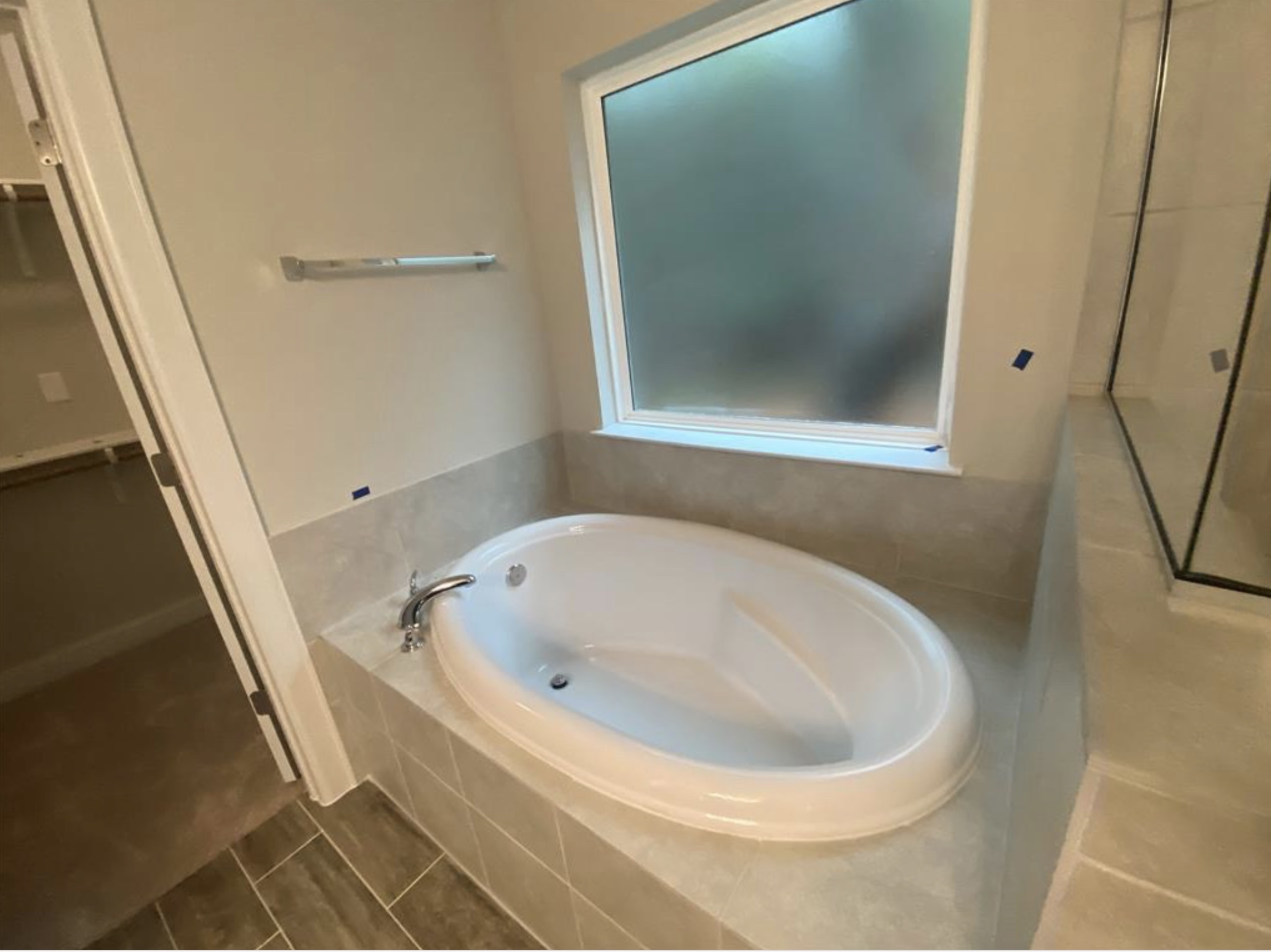 21643 Boggy Ford Road Lago Vista, TX 78645 - Photo 9 of 14 a white bath tub sitting in a bathroom