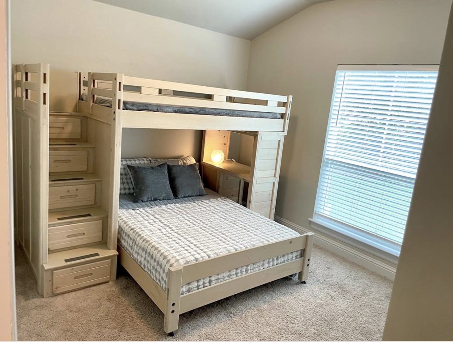 21643 Boggy Ford Road Lago Vista, TX 78645 - Photo 10 of 14 a bedroom with a bed and wooden floor