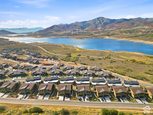 369 East Overlook Loop Kamas, UT 84036 - Photo 62 of 64 Community with multiple residences, adjacent to a large body of water, with mountainous terrain in the background