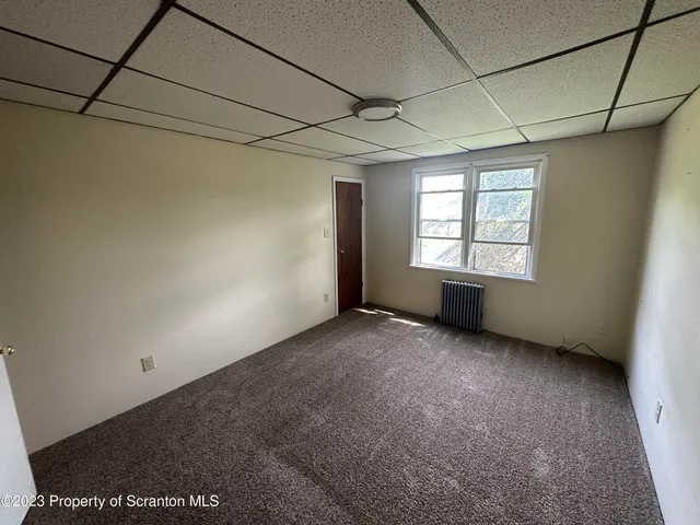 a view of a room that has a window in it