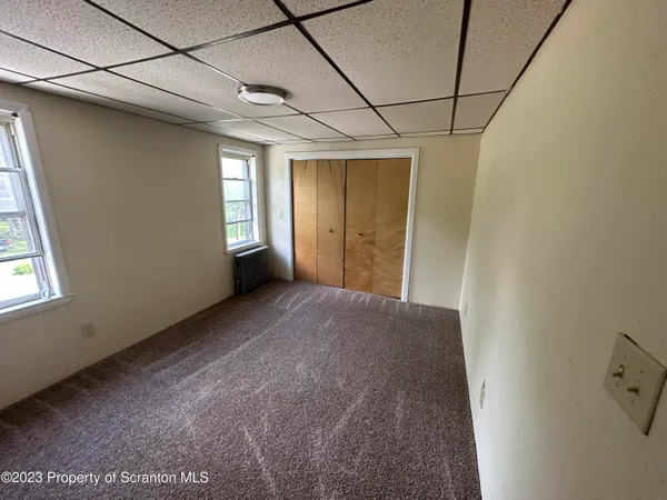 a view of empty room with windows