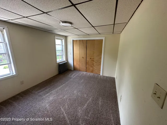 a view of empty room with windows