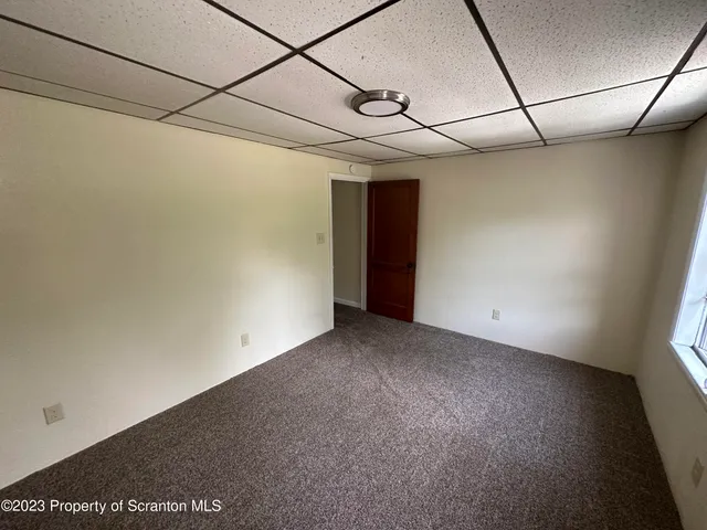 a view of a room with a hallway